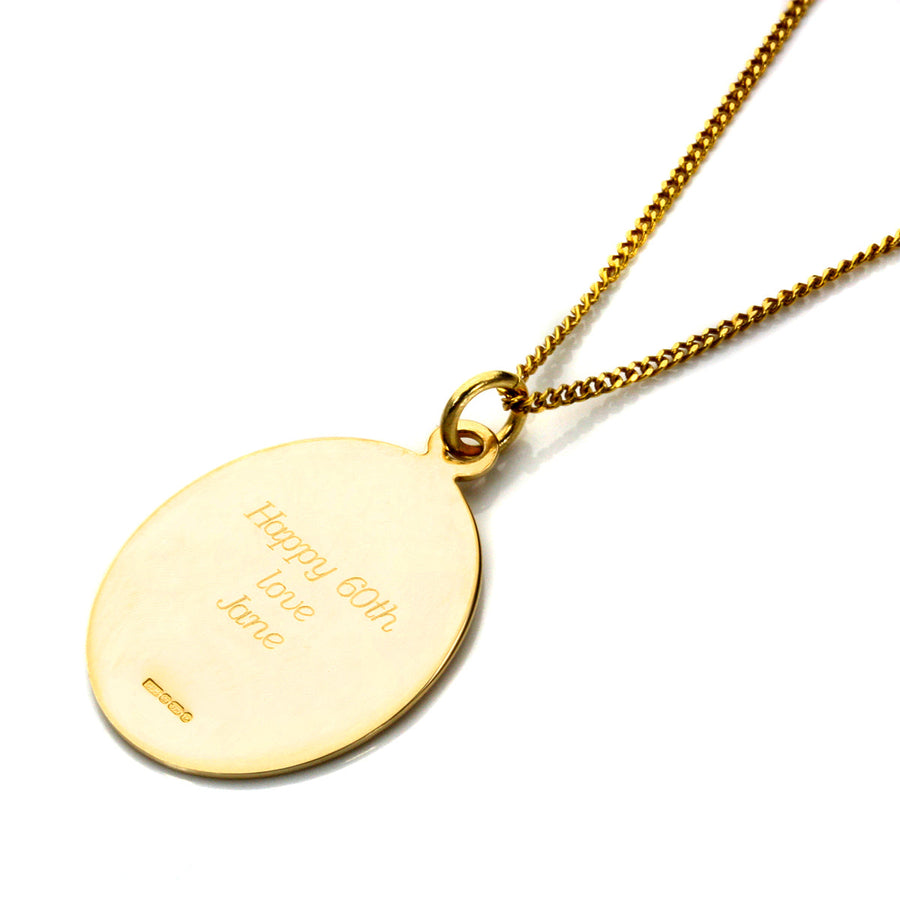 Detailed close-up of pendant engraving texture 