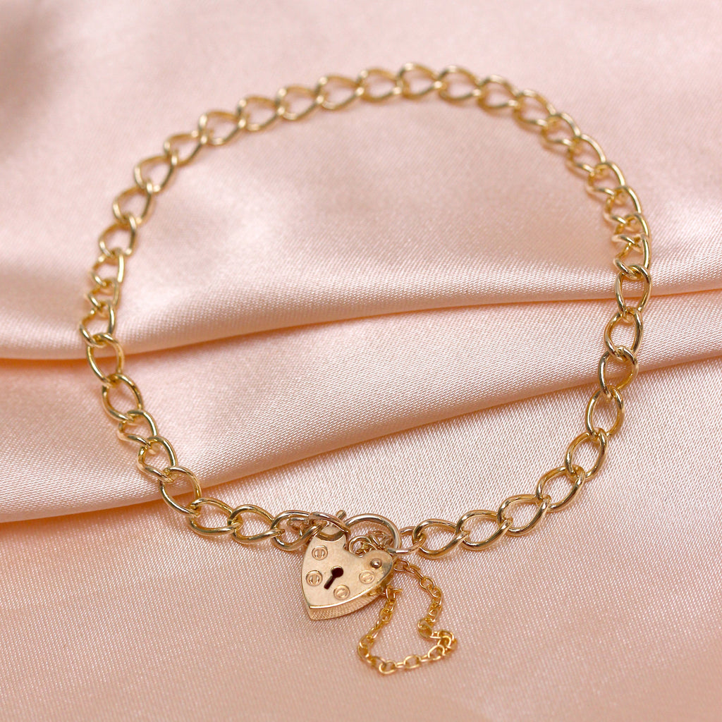 9ct yellow gold curb heart padlock charm bracelet